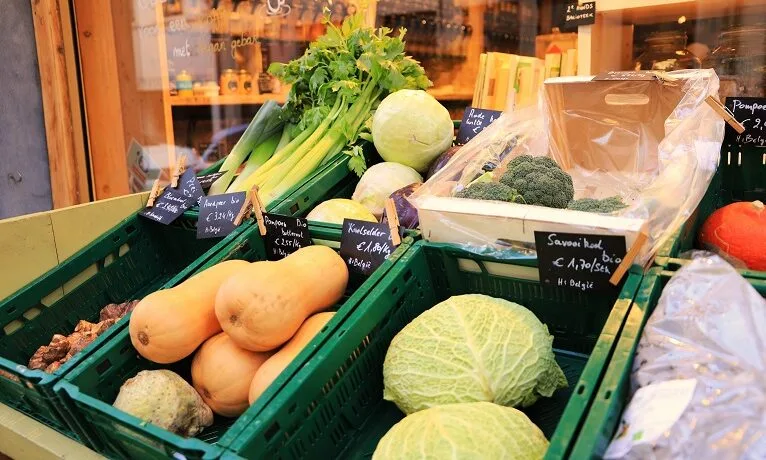 A university student buying budget-friendly groceries at an affordable supermarket in Tricity, Poland.
